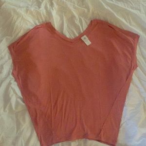 A light pink Cabi shirt size medium